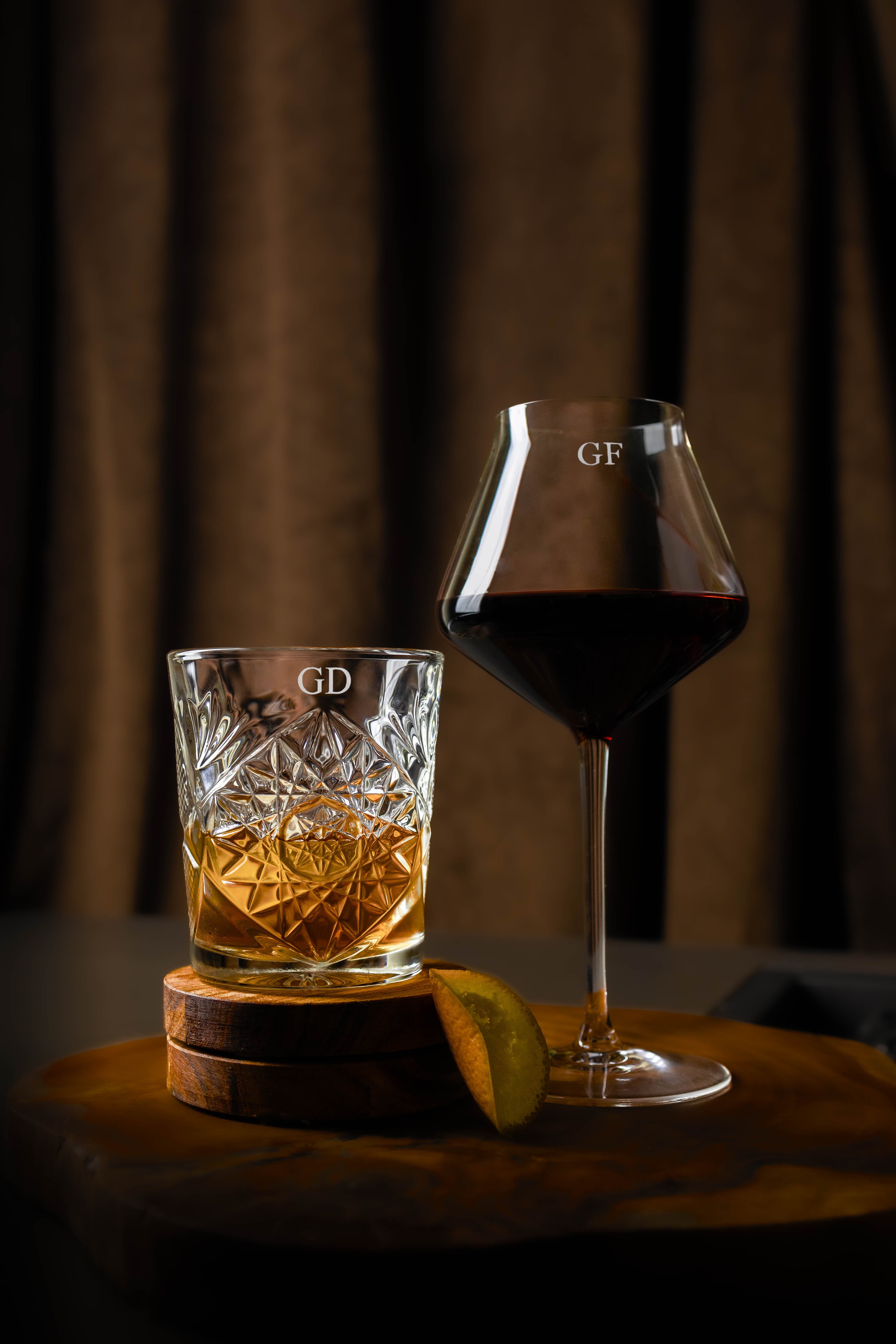 Set of two personalised glasses including a whiskey glass and a red wine glass