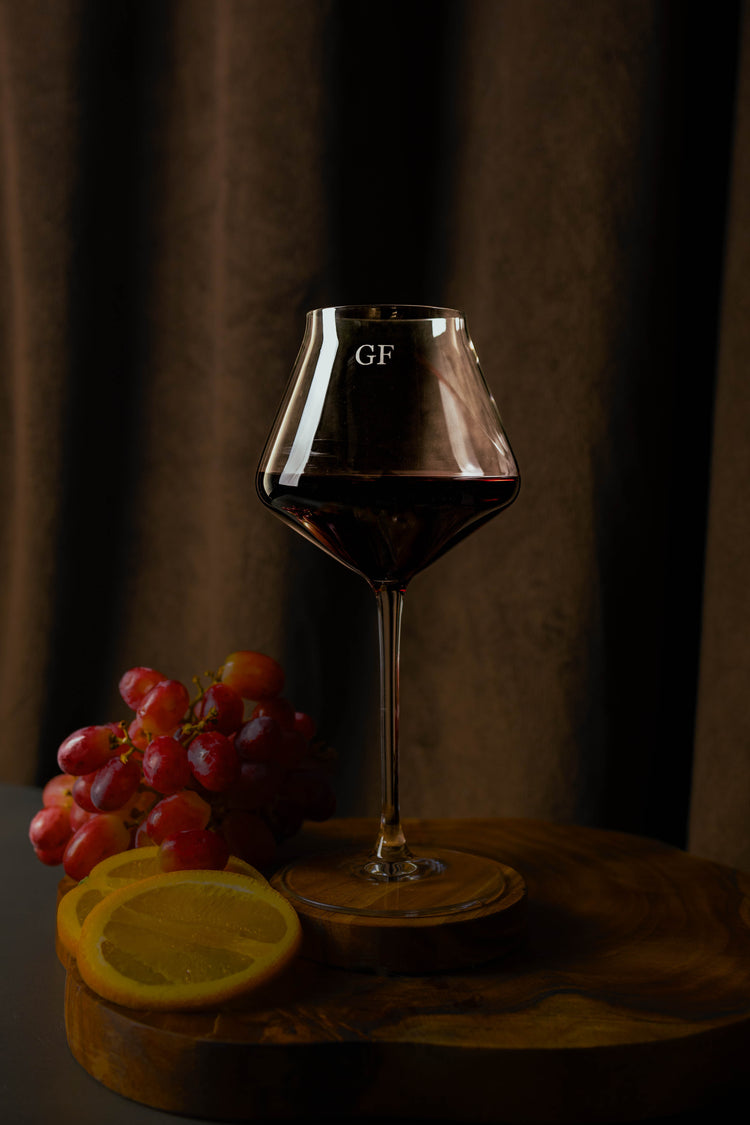 ruby red wine glass with monogrammed engraving